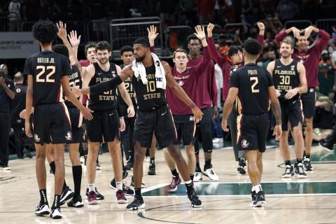 Florida State forward Malik Osborne celebrates with his teammates the Seminoles defeated Miami 61-60 on Saturday in Coral Gables. (LYNNE SLADKY/Associated Press)