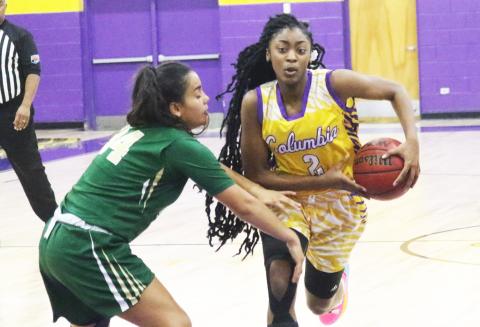 Columbia guard Na’Haviya Paxton drives to the basket as Nease guard Savannah Gomes defends on Tuesday night. (JORDAN KROEGER/Lake City Reporter)