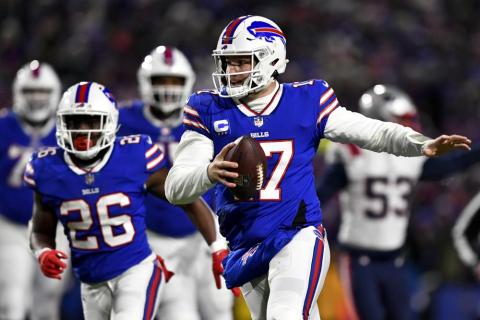 Buffalo Bills quarterback Josh Allen runs the ball during Saturday's wild-card playoff game against the New England Patriots in Orchard Park, N.Y. (ADRIAN KRAUS/Associated Press)