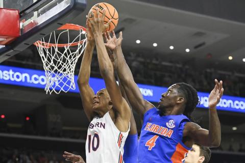 Auburn forward Jabari Smith (10) and Florida forward Anthony Duruji (4) battle for a rebound during Saturday's game in Auburn, Ala. (JULIE BENNETT/Associated Press)