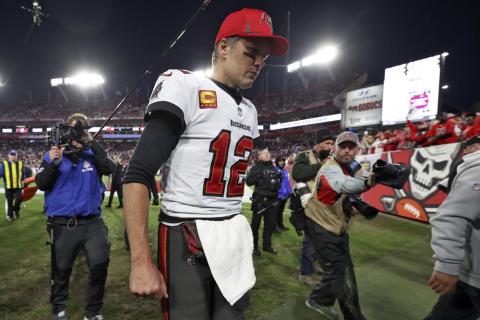Tampa Bay Buccaneers quarterback Tom Brady reacts as he leaves the field after the team lost to the Los Angeles Rams in a divisional playoff game on Sunday in Tampa. (MARK LOMOGLIO/Associated Press)
