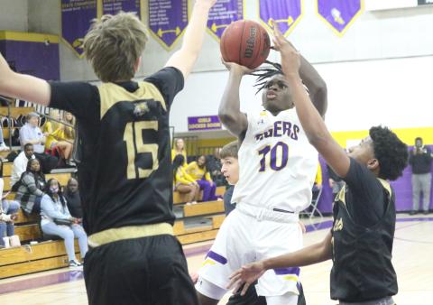 Columbia guard Isaac Broxey shoots against Buchholz on Tuesday night. (JORDAN KROEGER/Lake City Reporter)
