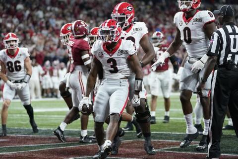 Georgia’s Zamir White celebrates after running for a touchdown during the second half of the College Football Playoff championship football game against Alabama Monday, Jan. 10, 2022, in Indianapolis. (PAUL SANCYA/Associated Press)