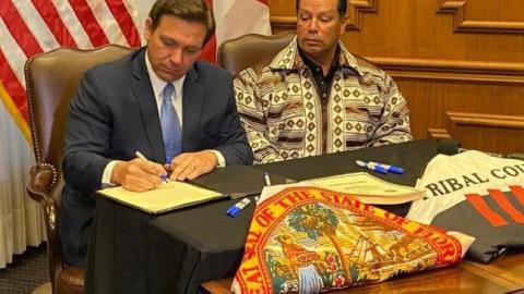 Gov. Ron DeSantis and Seminole Tribe of Florida Chairman Marcellus Osceola Jr. signed a gambling deal in April. (COURTESY)