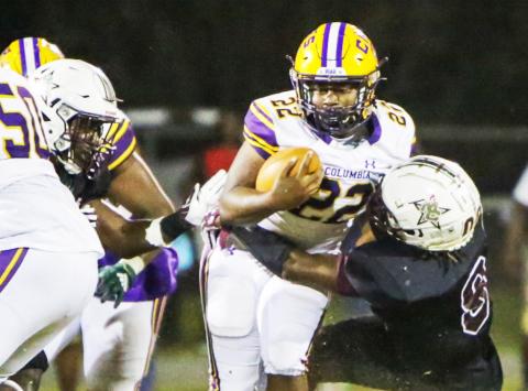 Columbia running back Tony Fulton is tackled on a carry against Madison County this past season. (BRENT KUYKENDALL/Lake City Reporter)