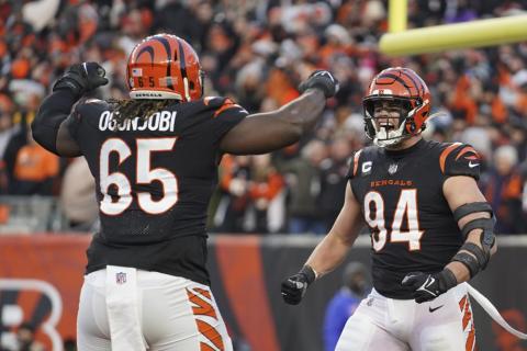 Cincinnati Bengals' Sam Hubbard (94) reacts with Larry Ogunjobi (65) after Hubbard sack Las Vegas Raiders quarterback Derek Carr during Saturday's wild-card playoff game in Cincinnati. (JEFF DEAN/Associated Press)