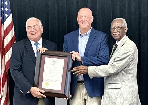 Florida Forestry Association President Carlton Jones, center, is presented a proclamation recognizing him as Lake City’s Arbor Day honoree by Mayor Stephen Witt and Councilman Eugene Jefferson. (COURTESY)