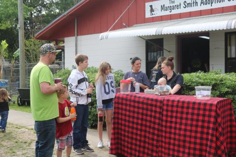 People congregate outside the Lake City Humane Society adoption center during an adoption event in April 2019. County officials will discuss options that would refine animal control services. (FILE)