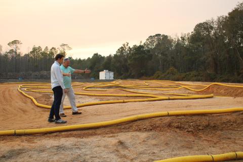 Landen Lewis (left) and Lance McDonald look over the track Thursday afternoon for the Florida RC Championship. (TONY BRITT/Lake City Reporter)