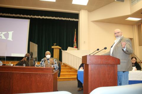 Lake City Utilities Director Paul Dyal (right) points to the crowd during the joint meeting Monday night. (TONY BRITT/Lake City Reporter)