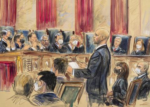 This artist sketch depicts lawyer Scott Keller standing to argue on behalf of more than two dozen business groups seeking an immediate order from the Supreme Court to halt a Biden administration order to impose a vaccine-or-testing requirement on the nation's large employers during the COVID-19 pandemic, at the Supreme Court in Washington, Jan. 7, 2022. (DANA VERKOUTEREN/Associated Press))