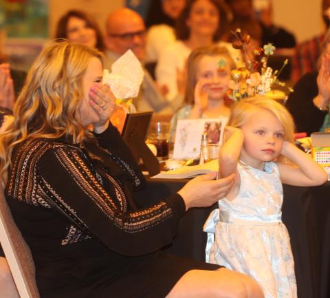 Kary Black (left) reacts after hearing her named called as the Suwannee County Teacher of the Year on Thursday. (PAUL BUCHANON/Special to the Reporter)