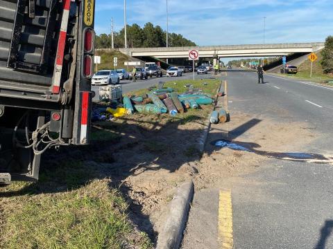 A truck hauling gas tanks overturned in the media of U.S. Hwy. 129 near the Interstate 10 interchange Friday north of Live Oak. The only tank that leaked was an oxygen tanks, according to first responders. (COURTESY)