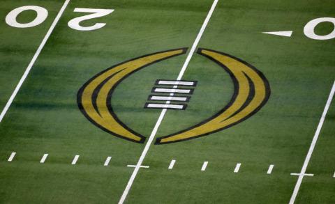 The College Football Playoff logo is shown on the field at AT&T Stadium on Jan. 1, 2021, in Arlington, Texas. (AP FILE)