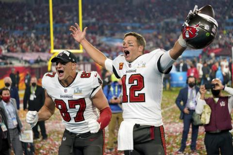 Tampa Bay Buccaneers tight end Rob Gronkowski, left, and quarterback Tom Brady (12) celebrate after winning Super Bowl 55 against the Kansas City Chiefs on Feb. 7, 2021 in Tampa. (AP FILE)