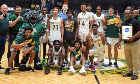FGC's basketball team celebrates after winning the Region 8 championship on Saturday. (COURTESY)