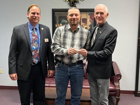 Robert Hammac (center) received the key to the City of Live Oak from Mayor Frank Davis (right). City Manager George Curtis looks on. (COURTESY)