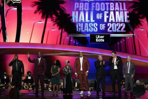 The 2022 NFL Football Hall of Fame class is seen during the NFL Honors show on Thursday in Inglewood, Calif. The class is: Tony Boselli, LeRoy Butler, Sam Mills, Richard Seymour, Bryant Young, Cliff Branch, Art McNally and Dick Vermeil. Filling in for Sam Mills is Melanie Mills and filling in for Tony Boselli is Elain Anderson. (MARK J. TERRILL/Associated Press)