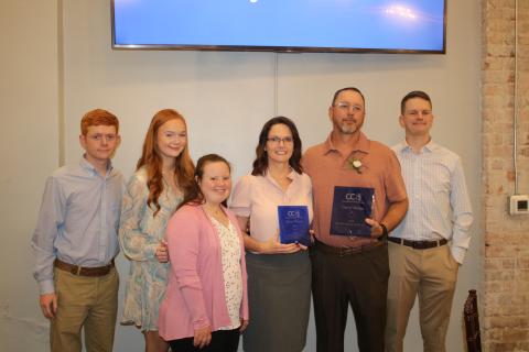 Dalton Thomas (from left), Darbie Thomas, Melanie Thomas, Jan Thomas, Darryl Thomas and DJ Thomas, pose for a photograph after Darryl Thomas was named the 2023 Columbia County Teacher of the Year. (TONY BRITT/Lake City Reporter)