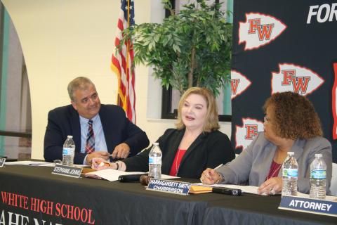 Stephanie Johns (middle) speaks as Superintendent Lex Carswell and Chairperson Narragansett Smith watch during Tuesday’s school board meeting. (TONY BRITT/Lake City Reporter)