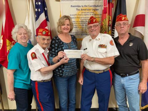 Spirit of the Suwannee Music Park General Manager Teena Peavey recently presented the Tri-County Veterans Fund with a $40,000 check from donations made during the Suwannee Lights event at the park. Pictured with Peavey (center) are Tri-County Veterans Fund volunteers Pat Walsh (from left), Mike Russell, Jim Kennedy and Russ Carson. (COURTESY)