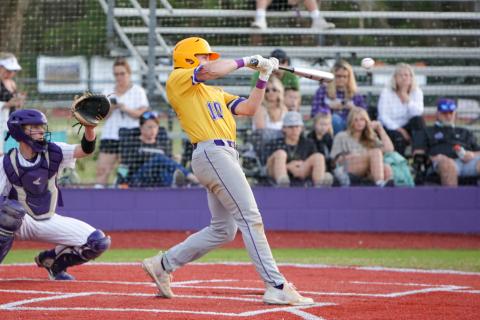 Columbia’s Brent Howard connects for a hit Friday night at Gainesville in the teams’ District 3-5A opener. (BRENT KUYKENDALL/Lake City Reporter)