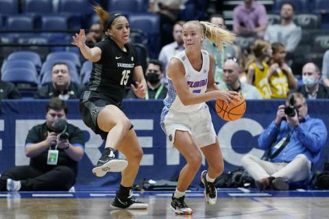Vanderbilt's Brinae Alexander (15) defends against Florida's Alberte Rimdal (right) during the women's Southeastern Conference tournament on Thursday in Nashville, Tenn. (MARK HUMPHREY/Associated Press)