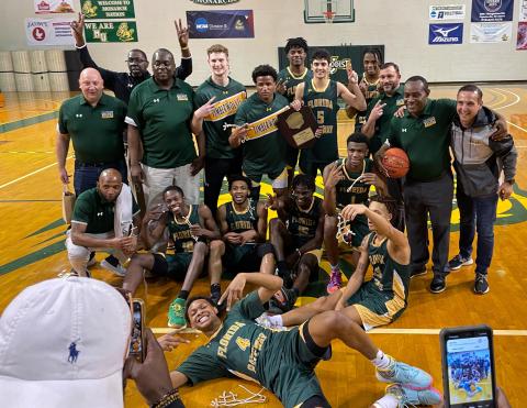 FGC’s basketball team celebrates after defeating Fayetteville Tech to win the South Atlantic District B championship on Saturday. (COURTESY)