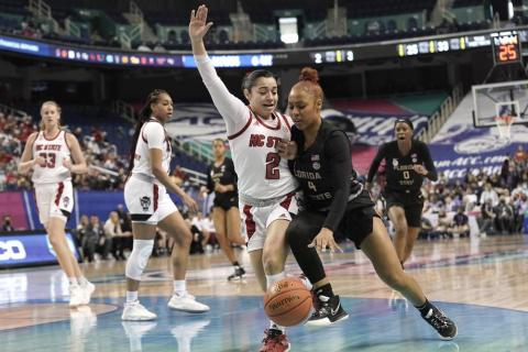 North Carolina State guard Raina Perez (2) defends against Florida State guard Sara Bejedi (4) during Friday's ACC tournament quarterfinal in Greensboro, N.C. (GERRY BROOME/Associated Press)