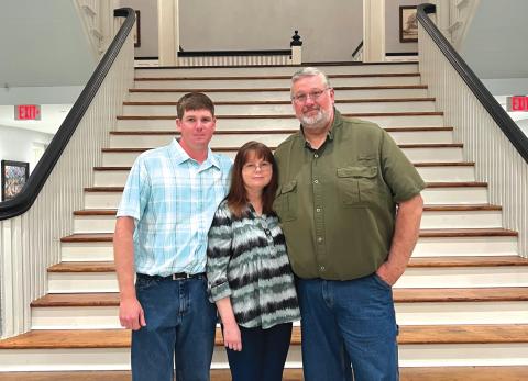 Thomas Henry (right) stands with his son, Josh, and wife, Zola, at his retirement party on Tuesday. Henry was recently hired by the City of High Springs as the Director of Public Works. (COURTESY)