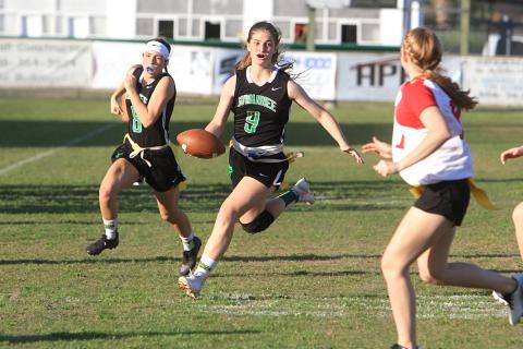 Suwannee quarterback Maci Campbell scrambles up the field against Bradford last season while Macy Bowers follows behind. (FILE)