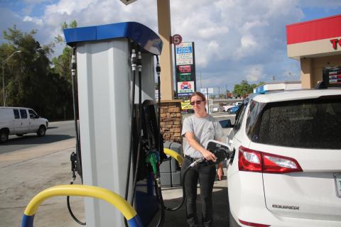 Kimberly Rice pumps $30 worth of gas into her vehicle Tuesday afternoon where she paid $4.25 per gallon of unleaded at the Stop N Go on Main Boulevard. (TONY BRITT/Lake City Reporter)