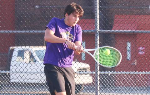 Columbia’s Aidan Boudreau returns a shot against Fleming Island’s Williams Hughes on Wednesday. (JORDAN KROEGER/Lake City Reporter)