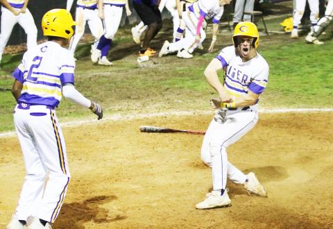 Columbia’s Hayden Gustavson celebrates after scoring the game-winning run against North Florida Christian on Friday night. (JORDAN KROEGER/Lake City Reporter)