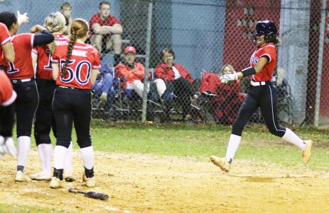 Fort White outfielder Morgan Kelly is all smiles as she heads toward home plate after hitting a home run against Lafayette on Thursday night. (MORGAN MCMULLEN/Lake City Reporter)