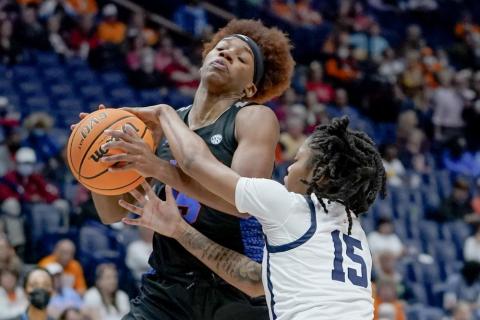 Florida's Nina Rickards, left, drives against Mississippi's Angel Baker (15)during Friday's game at Southeastern Conference tournament in Nashville, Tenn. (MARK HUMPHREY Humphrey)