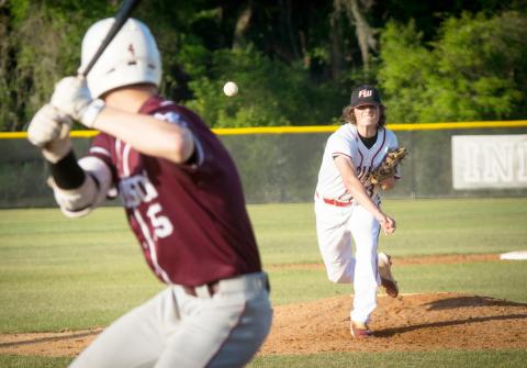 Fort White pitcher Jonathan Fischer throws a pitch to Madison County’s JD Bryan during Tuesday’s game. (CHRISTINA FEAGIN/Special to the Reporter)