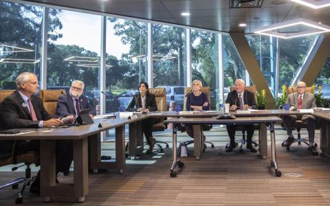 Reedy Creek Improvement District Administrator John Classe, from left, Ed Milgrim, legal counsel, Leila Jammal, Board of Supervisors, Jane Adams, BOS, Larry Hames, President of the BOS, and Don Greer, BOS, meet Wednesday. (WILLIE J. ALLEN JR./Orlando Sentinel/AP)