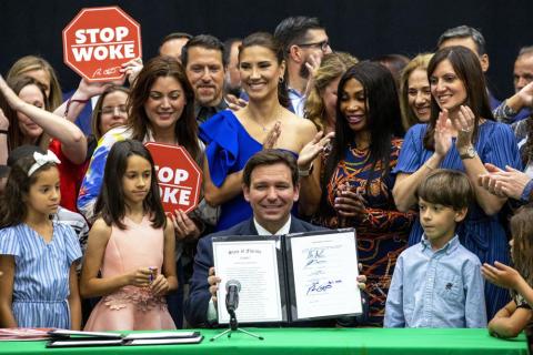 Florida Gov. Ron DeSantis reacts after publicly signing HB7, “individual freedom,” also dubbed the “stop woke” bill during a news conference at Mater Academy Charter Middle/High School in Hialeah Gardens on Friday. (DANIEL A. VARELA/Miami Herald/Associated Press)