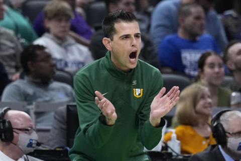 Former San Francisco head coach Todd Golden applauds his team during a game against Murray State in the first round of the NCAA tournament on March 17 in Indianapolis. (DARRON CUMMINGS/Associated Press)