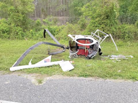 A helicopter crashed along State Road 47 on Saturday morning as it tried to escape dense fog. The pilot and passenger sustained just minor injuries. (COURTESY)