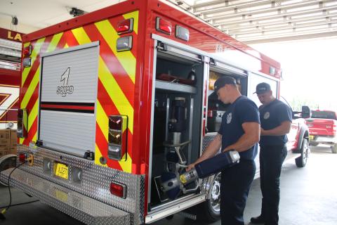 Hunter Anderson (from left) and Adam Lockwood, Lake City Fire Department firefighters, inventory extrication equipment that is carried in the department’s new Quick Response Truck on Wednesday afternoon. (TONY BRITT/Lake City Reporter)