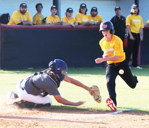 Fort White’s Patrick Kennedy beats a throw to home plate to score against Keystone Heights on Thursday. (JORDAN KROEGER/Lake City Reporter)