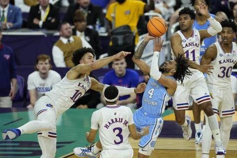 North Carolina guard R.J. Davis (4) shoots against Kansas forward Jalen Wilson (10) during the national championship game on Monday in New Orleans. (GERALD HERBERT Herbert)