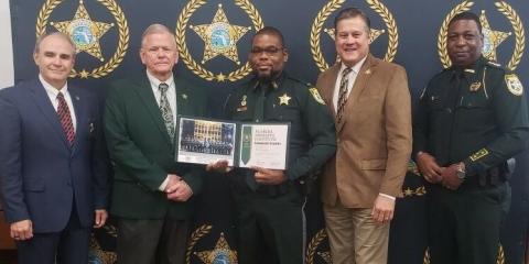 Columbia County Sheriff’s Office Lt. Martin Lee graduated from the Florida Sheriffs Institute Commanders Academy on Friday. Pictured with Lee (center) are Florida Sheriffs Association Director Steve Casey (from left), FSA President Sheriff Bobby McCallum of Levy County, Sheriff Mark Hunter and Sheriff Morris Young of Gadsden County. (COURTESY)