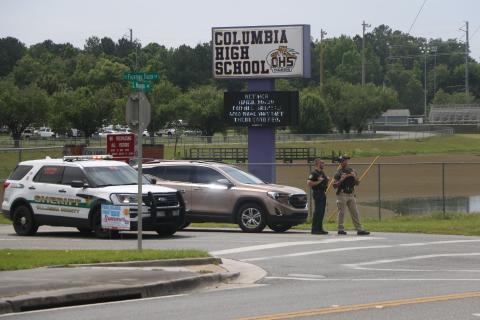 Law enforcement blocks the entrance to Columbia High School on Monday morning after a bomb threat was made against the school. A sweep of the building turned up nothing suspicious. (MORGAN MCMULLEN/Lake City Reporter)