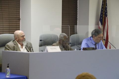 Councilman Todd Sampson (right) listens alongside fellow councilman Eugene Jefferson and interim city manager Paul Dyal during Monday's city council meeting (MORGAN MCMULLEN/Lake City Reporter)