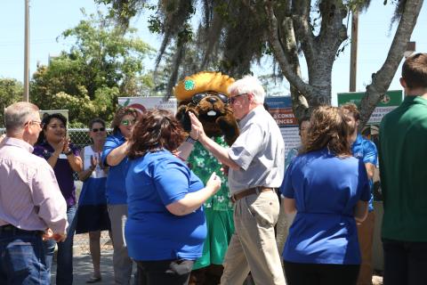 Dr. Scott Angle (right) gets a high-five from county extension director Heather Janney in front of Bellamy Beaver Friday afternoon. (MORGAN MCMULLEN/Lake City Reporter)