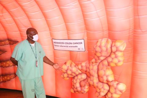 John Young Jr., a registered nurse, points out how advanced colon cancer could look when attached to the inner wall of the colon. (MORGAN MCMULLEN/Lake City Reporter)