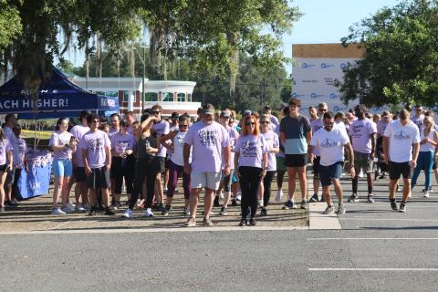 Grace Duncan’s parents Burt and Cissy (center) help lead the start of the second Grace’s Race 5K Saturday. (JAMIE WACHTER/Lake City Reporter)